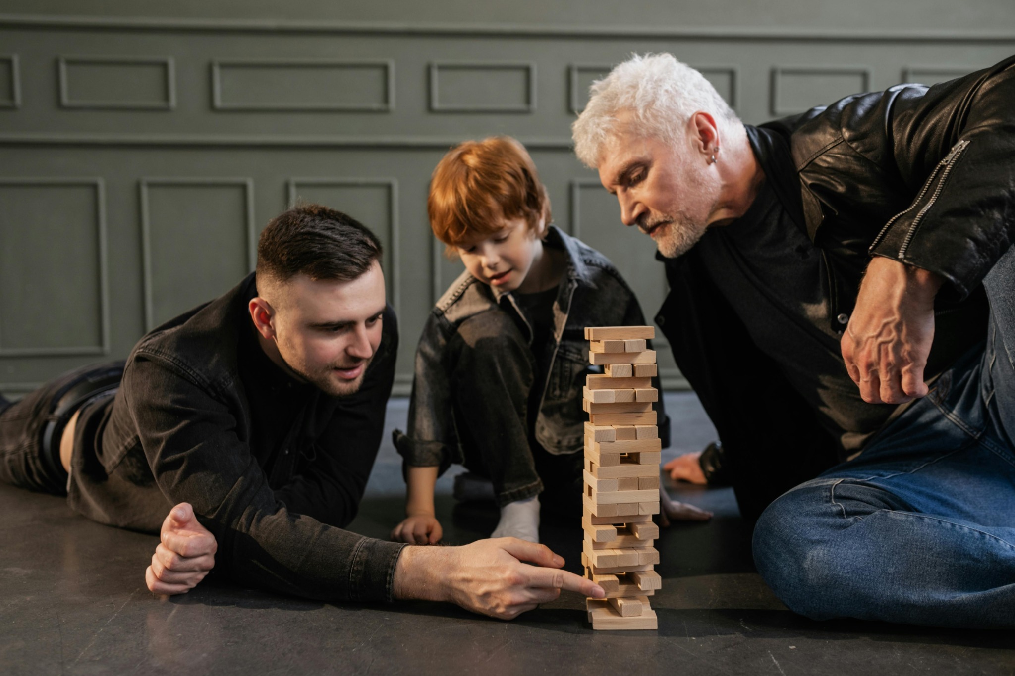 Three generations spending time together, representing youth, middle life, and older age